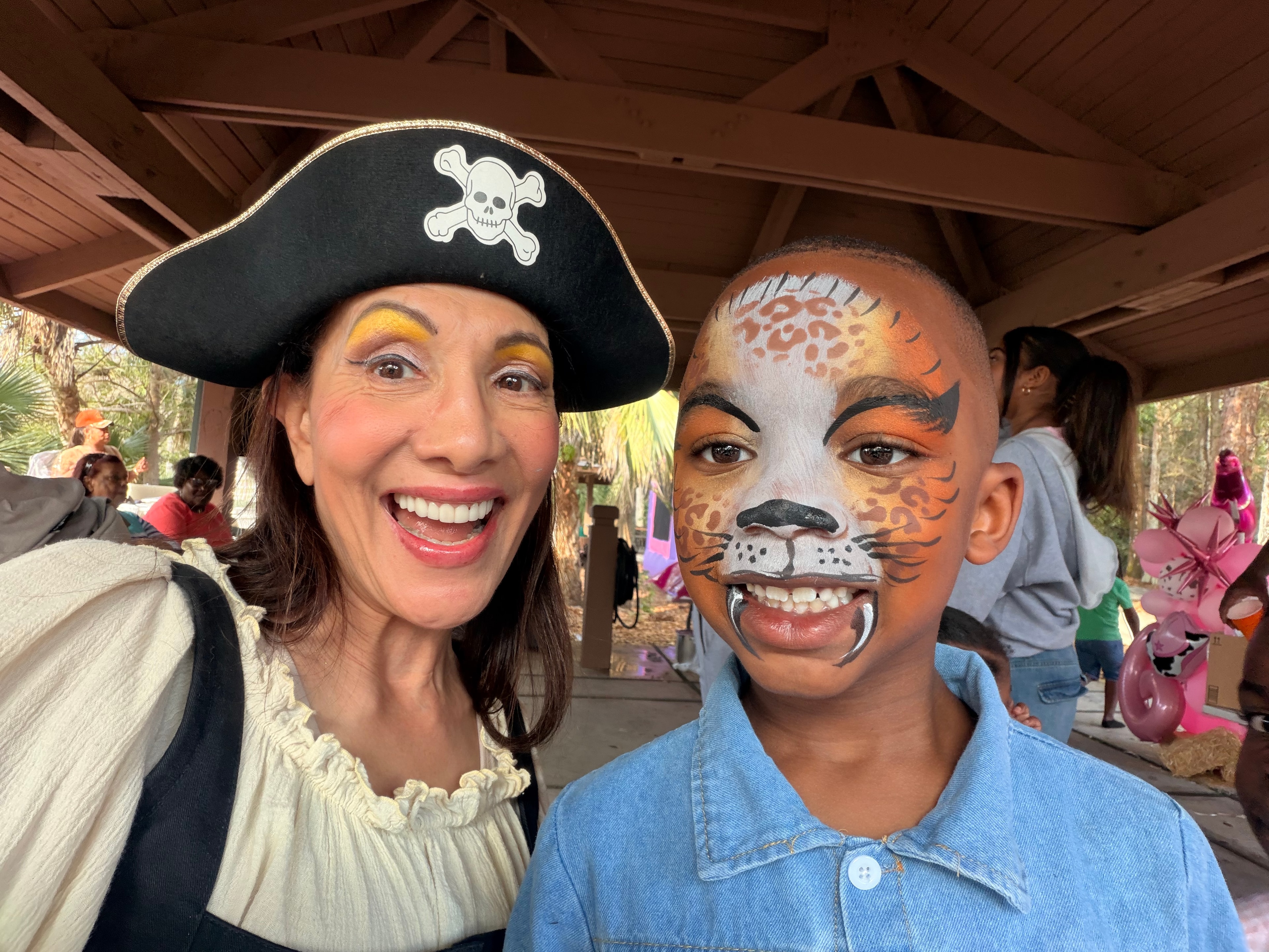 Leopard face painting by OOOPSY Face Painting Team at event