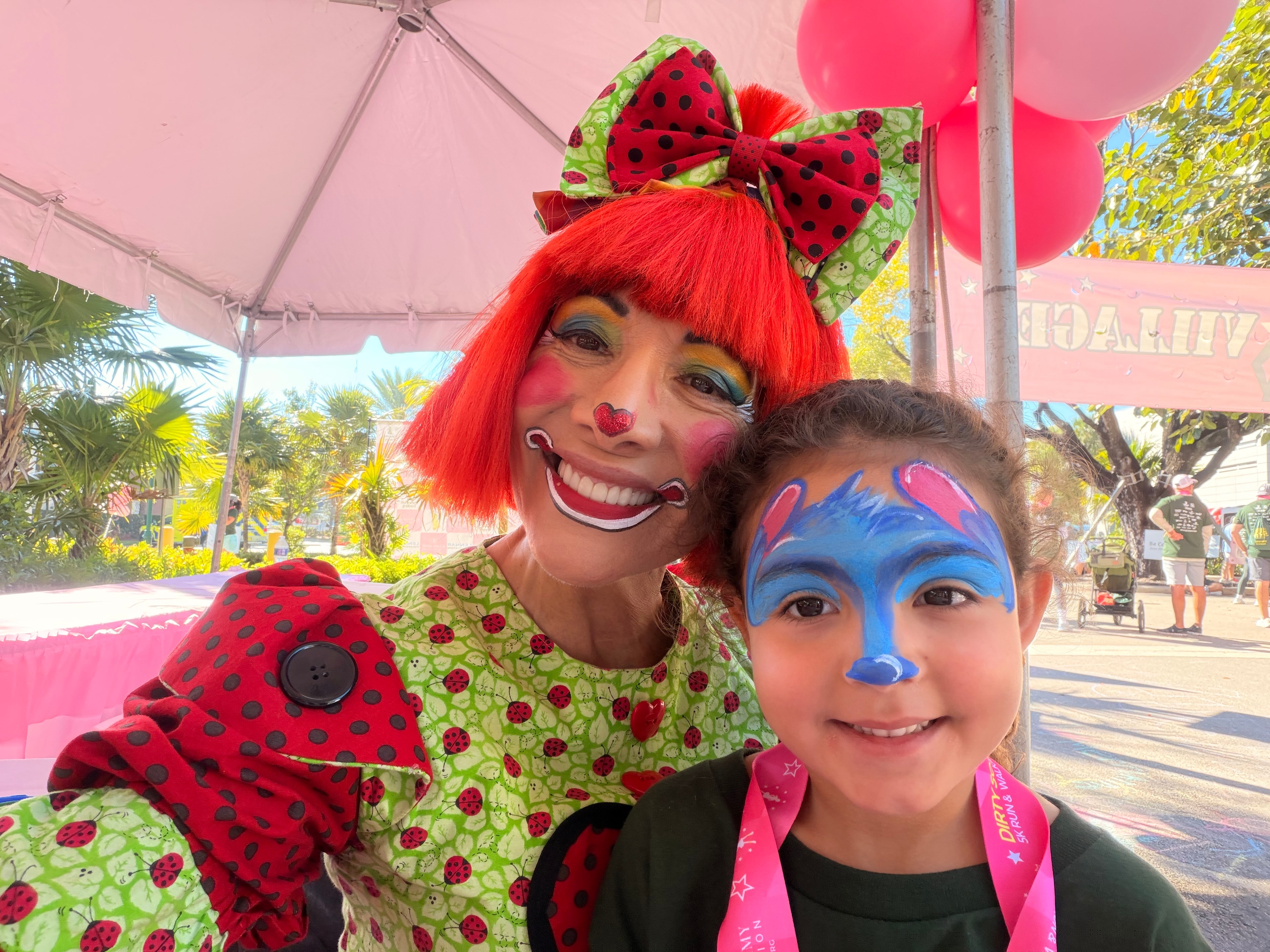 Stitch face paint with OOOPSY clown performer at festival
