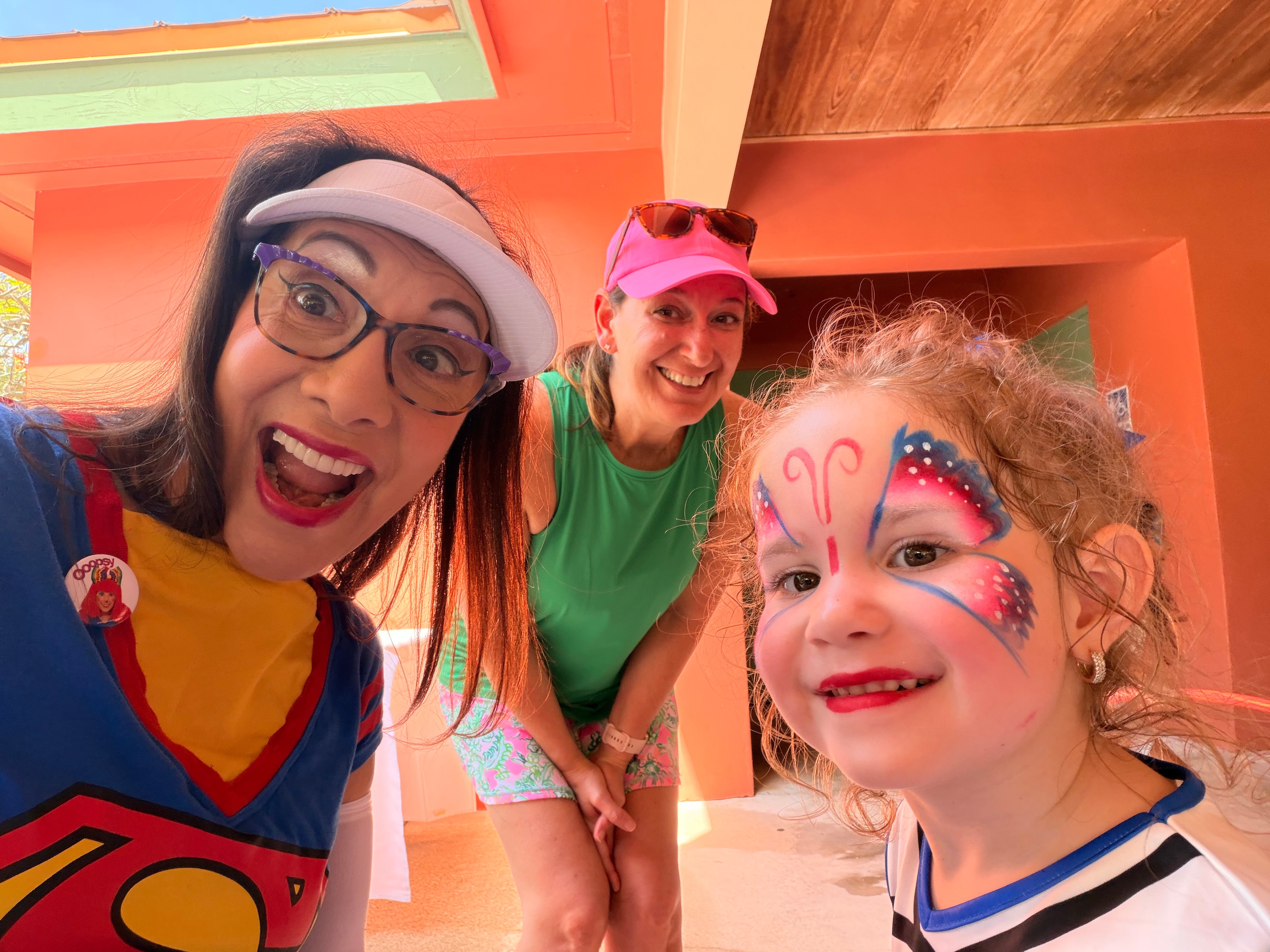 OOOPSY Face Painting Team with butterfly face paint at event
